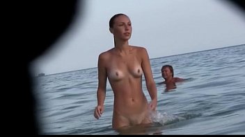 watch a naked chick at xyouporn the beach tan her hot body 